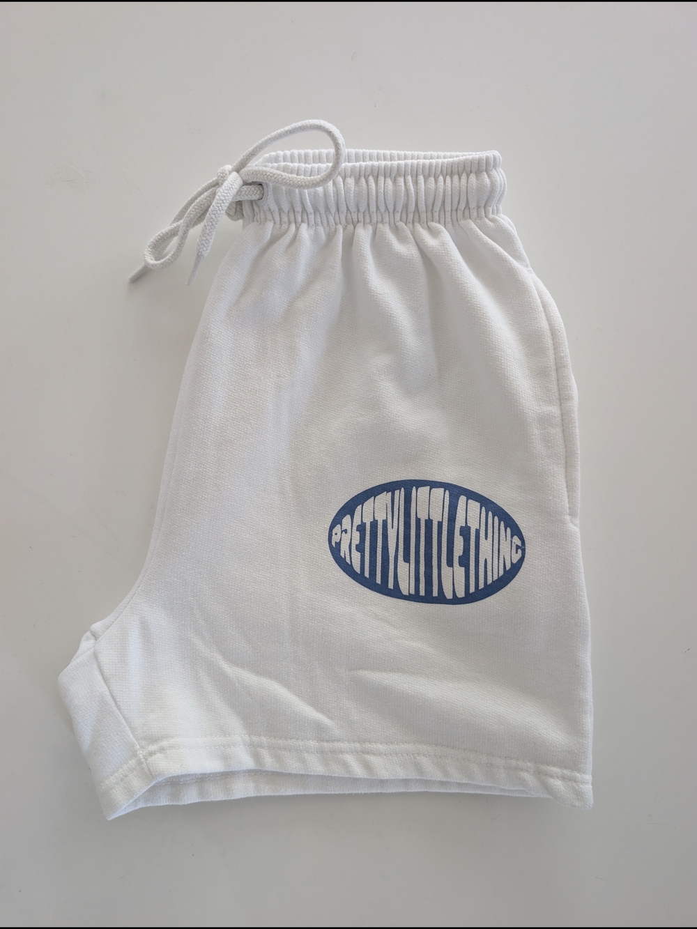 PrettyLittleThing White Drawstring Shorts with Blue Logo